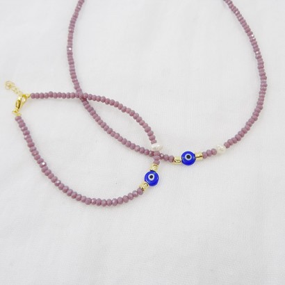 Women's necklace with eyelet, purple crystals and natural pearl